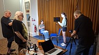 Students working on a scene in front of a camera